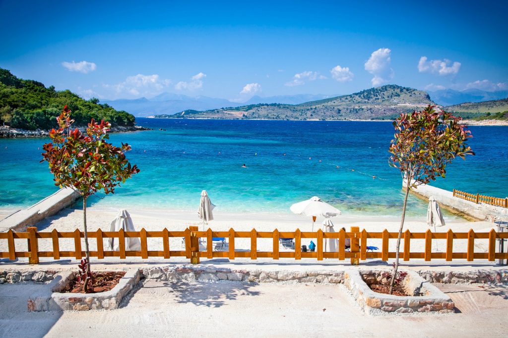 Sunshade umbrellas and deckchairs on the beautiful Ksamil beach, Albania.